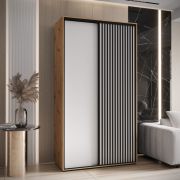 Schiebetürenschrank Mina in Eiche/Weiß, Front aus laminierter Platte, Anti Staubbürsten, schwarze Metallgriffe, platzsparend, 235,2 x 130 x 60 cm