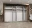 Drehtürenschrank mit zwei Spiegeltüren Eiger 100, Farbe: Eiche Artisan, 3 Meter breit, Griffe: Schwarz, vier Kleiderstangen, Kleiderschrank, vier Fächer